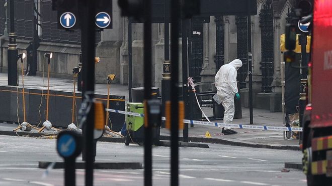 Forensics officers close to the Houses of Parliament in London