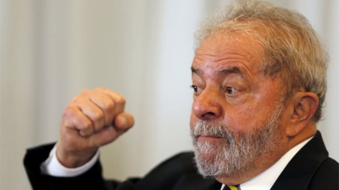 Former Brazilian President Luiz Inacio Lula da Silva reacts as he speaks during a news conference with international media in Sao Paulo, Brazil, March 28, 2016.