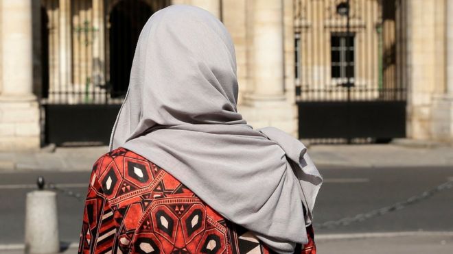 A woman wearing a Muslim headscarf stands outside France's top administrative court in Paris (Aug. 26, 2016)
