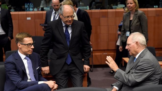 German Finance Minister Wolfgang Schaeuble (R) talks with Maltese Finance minister Edward Scicluna (C) and Finnish Finance Minister Alexander Stubb (L) in Brussels on 24 May 2016