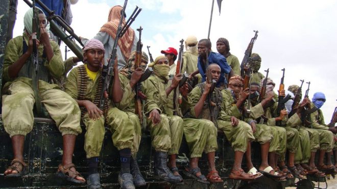 Al-Shabab fighters sit on a truck as they patrol in Mogadishu