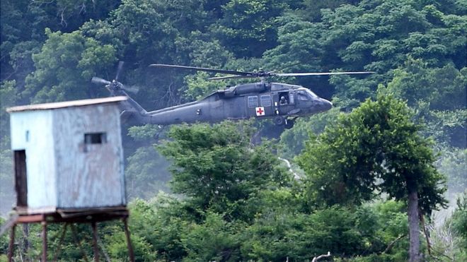 A military Helicopter joins in the search efforts Friday, June 3, 2016, for 6 missing soldiers from Fort Hood, Texas. (Rusty Schramm/The Temple Daily Telegram via AP) MANDATORY CREDIT