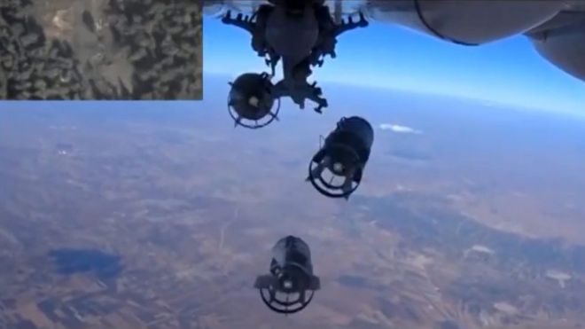 A handout frame grab taken from a video footage made available on the official website of the Russian Defence Ministry on 05 October 2015 shows bombs dropped by a Russian warplane
