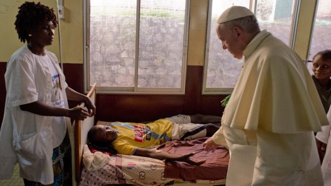 Pope Francis comforts a child during a stop at a paediatric hospital in Bangui, Central African Republic. 29 Nov 2015