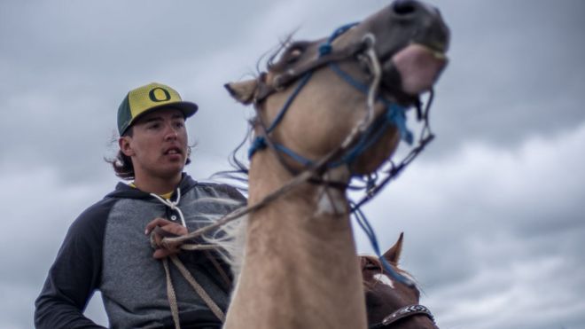 A cohort of young men patrol the Red Warrior Camp calling themselves "spirit riders."