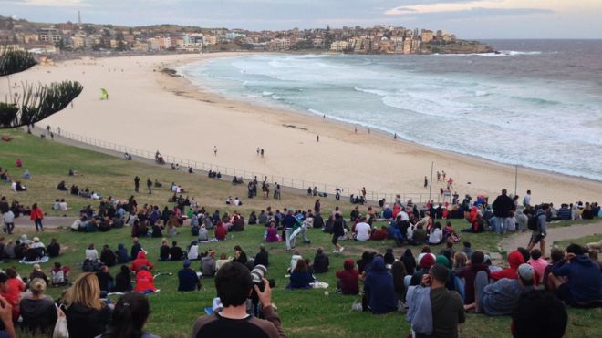 Onlookers gathered at Bondi Beach in Australia in the hope of catching a first glimpse of the supermoon