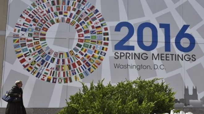 A sign announcing the 2016 spring meetings of the International Monetary Fund and World Bank