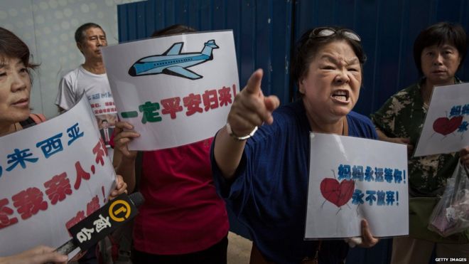 Angry Chinese relatives of missing passengers on MH370 outside Malaysia Airlines office in Beijing. 6 Aug 2015