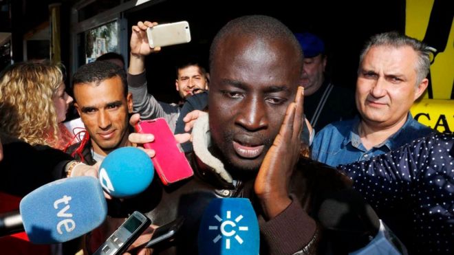 Senegalese man reacts after discovering that he has one ticket of the number 79,140, the first prize of El Gordo Christmas lottery, in Roquetas de Mar, Andalusia, southern Spain, 22 December 2015.