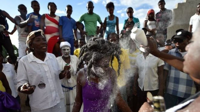 A devotee in the role of a spirit known as a Gede is seen during ceremonies honouring the Haitian voodoo spirits of Baron Samdi and Gede on the Day of the Dead in Port-au-Prince on 1 November, 2015