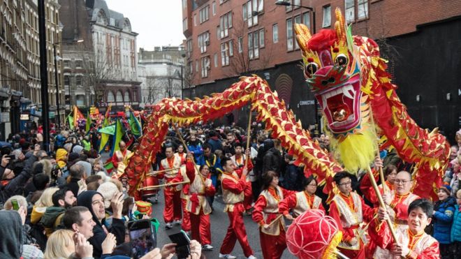 Performers take part in a dragon dance during the Chinese New Year parade