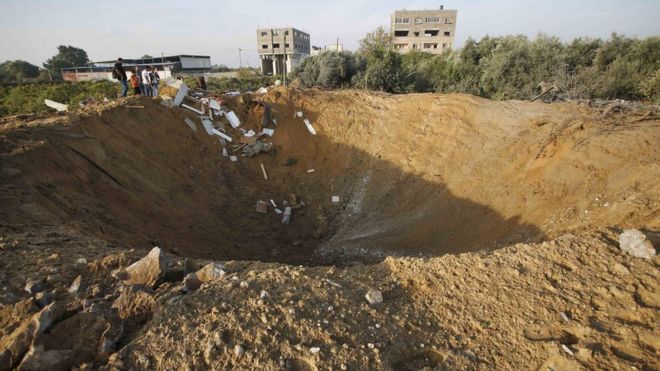 A crater at the scene of an Israeli air strike in Gaza City on 11 October, 2015