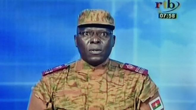 A picture taken on 17 September , 2015 shows a TV screen during the broadcast of the speech of Lieutenant-colonel Mamadou Bamba announcing that a new "National Democratic Council" had put an end "to the deviant regime of transition" in Burkina Faso