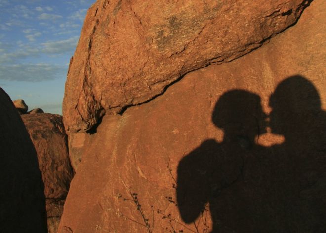 A shadow of people kissing in Namibia