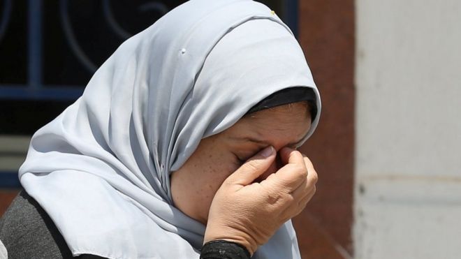 An unidentified woman reacts as she waits for news about the vanished EgyptAir plane, outside the Egyptair in-flight service building at Cairo International Airport, Egypt May 19, 2016.
