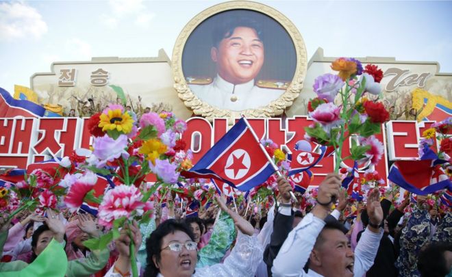People cheering during the military parade for the 70th anniversary of the founding Workers' Party, Pyongyang, North Korea - Saturday 10 October 2015