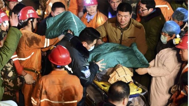 A trapped miner is rescued from a collapsed gypsum mine in Pingyi County, east China's Shandong Province on 25 December.