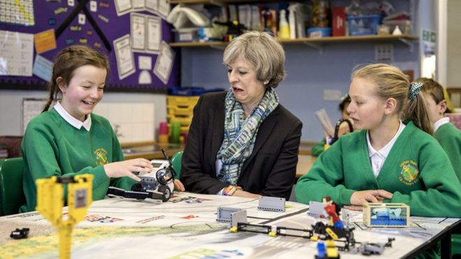 Theresa May in a school