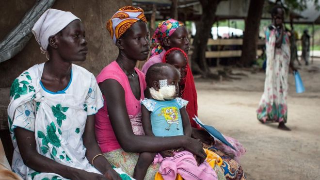 Families with malnourished children wait to receive treatment at the Leer Hospital, South Sudan, 7 July 2014
