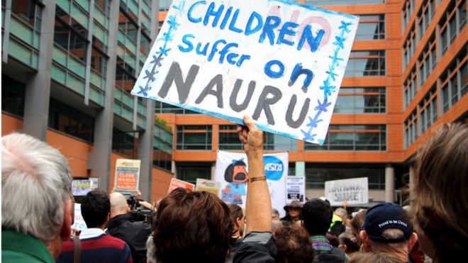 Activists hold placards and chant slogans as they protest outside the offices of the Australian Immigration Department in Sydney, Australia, in this file picture taken February 4, 2016.