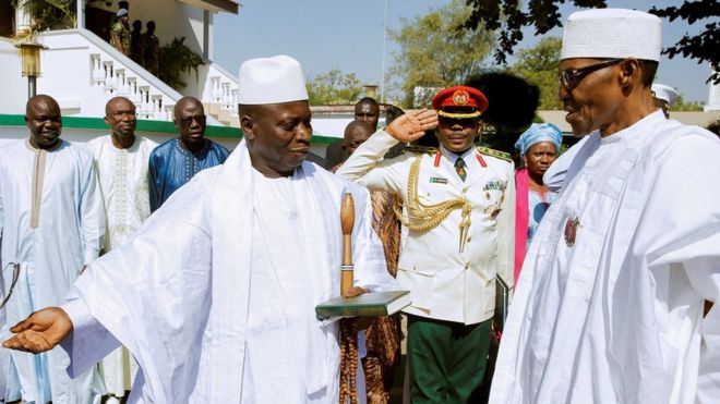 Gambian President Yahya Jammeh welcoming Nigeria's leader, Muhammadu Buhari, to Banjul