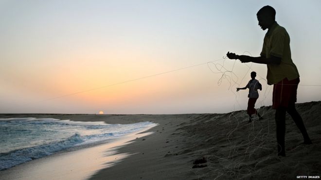 January 4, 2010 shows young Somali boys drawing their fishing lines at the coastal town of Hobyo in northeastern Somalia