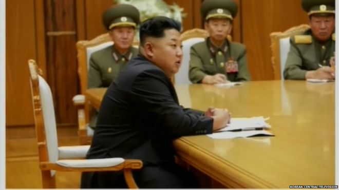 Screen grabs of Kim Jong-un attending the emergency expanded meeting of central military commission on the night of 20 August 2015