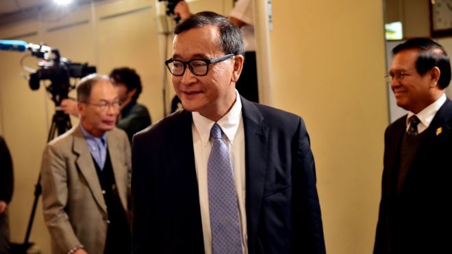 Cambodia"s main opposition Cambodia National Rescue Party president Sam Rainsy arrives at a conference room to speak to the press in Tokyo on November 10, 2015