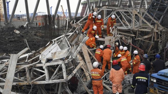 In this photo released by Xinhua News Agency, rescue workers look for survivors after a work platform collapsed at the Fengcheng power plant in eastern China"s Jiangxi Province, Nov. 24, 2016
