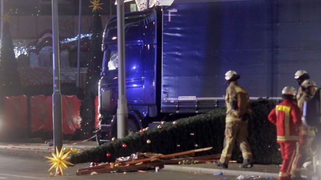 A fallen Christmas tree lies beside the crashed lorry in Berlin, 19 December