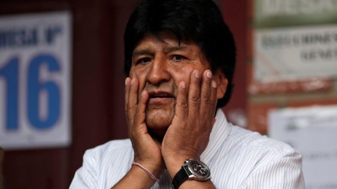 Bolivia's President Evo Morales gestures after casting his vote