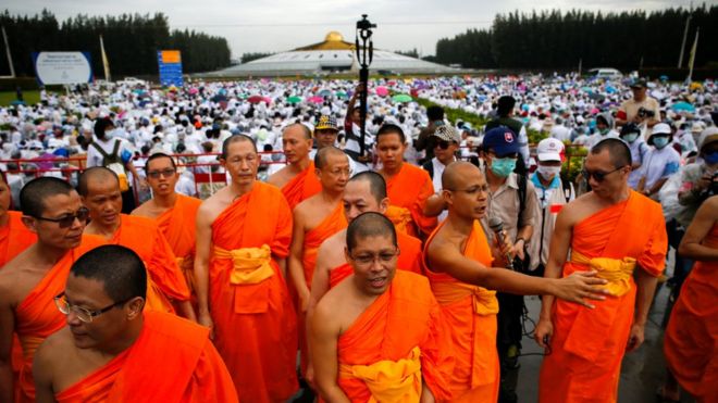 Buddhist monks and followers gather inside the Wat Phra Dhammakaya temple complex in anticipation of a planned police raid, in Pathum Thani province, north of Bangkok, Thailand, June 16, 2016.