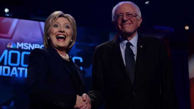 US Democratic presidential candidates Hillary Clinton and Bernie Sanders shake hands before participating in the MSNBC Democratic Candidates Debate at the University of New Hampshire in Durham