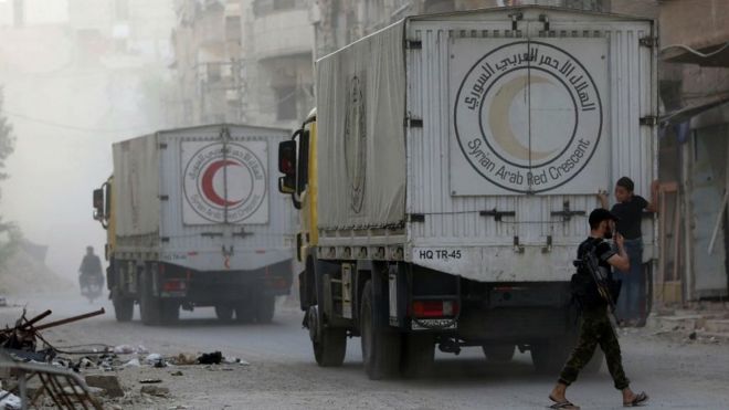 Syrian Arab Red Crescent truck delivering aid in rebel-held area of Harasta on the north-eastern outskirts of the capital Damascus on August 29, 2016