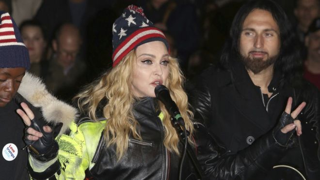 Madonna performing in support of the Democratic presidential candidate Hillary Clinton at Washington Square Park