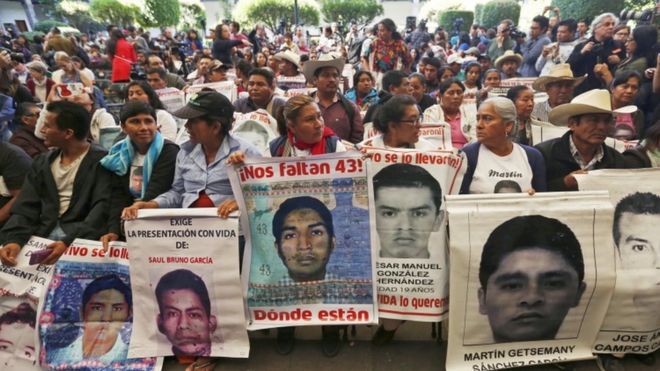 Relatives of the 43 missing students attend the delivery of the panel's final report in Mexico City
