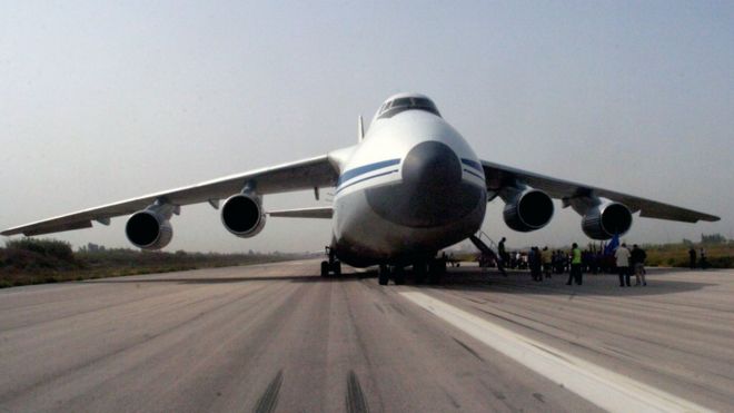 Picture released by Syrian Arab News Agency (SANA) shows Russian plane carrying humanitarian aid being unloaded at Martyr Bassil al-Assad international airport in Latakia. 12 Sept 2015