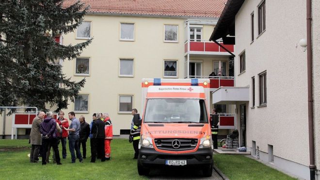 An ambulance stands by the entrance to an apartment building on April 19, 2016 in Rosenheim