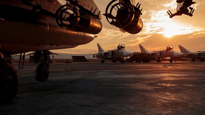 This photo taken on Friday, Dec. 18, 2015 and provided by the Russian Defense Press Service, shows a Russian Su-25 ground attack jet parked at the Hemeimeem air base in Syria