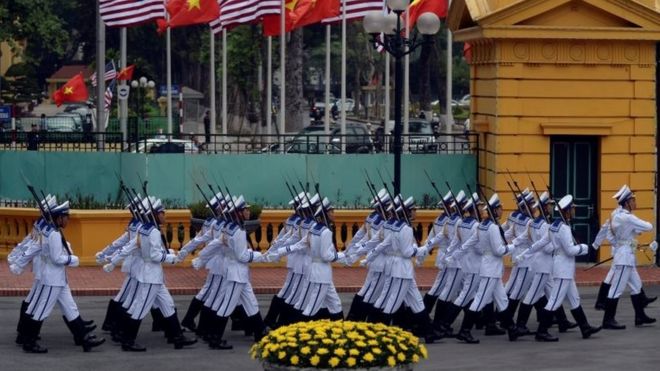 Vietnamese Navy honour guard marches to take position prior to the arrival of US President Barack Obama for a welcoming ceremony at the Presidential Palace in Hanoi