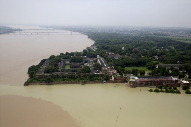 The Flooded river Ganges is seen from a helicopter in Allahabad, India, Friday, Aug. 26, 2016.