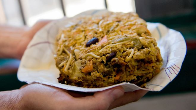 An inmate holds a serving of Nutraloaf in South Burlington, Vermont, 2008