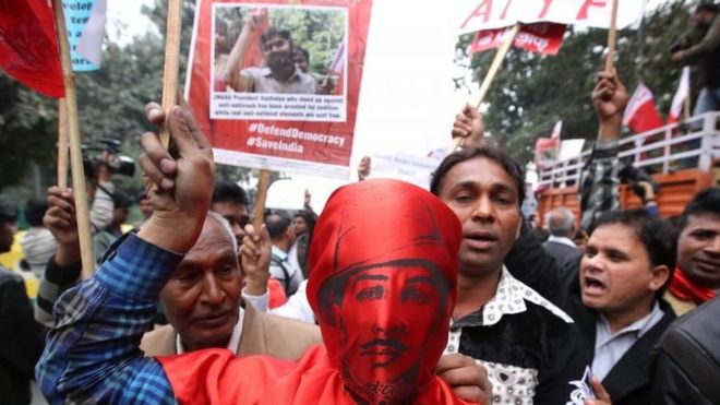 An Indian activist wearing the mask of Indian revolutionary Bhagat Singh along with other Jawaharlal Nehru University (JNU) students and their supporters participate in a protest march in New Delhi, India, 18 February 2016.