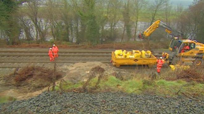 Engineers have been working to clear the landslide from the rail line near Hexham / BBC News