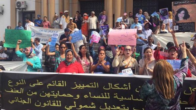 People protesting outside the court ahead of the court case for two girls who have been charged with gross indecency for wearing skirts in a market in Inezgane in Morocco 06 July 2015