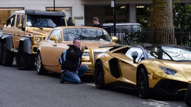 Fleet of gold cars in Knightsbridge