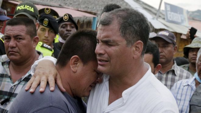 Ecuador"s President Rafael Correa (R) embraces a resident after the earthquake, which struck off the Pacific coast, in the town of Canoa, Ecuador April 18, 2016.