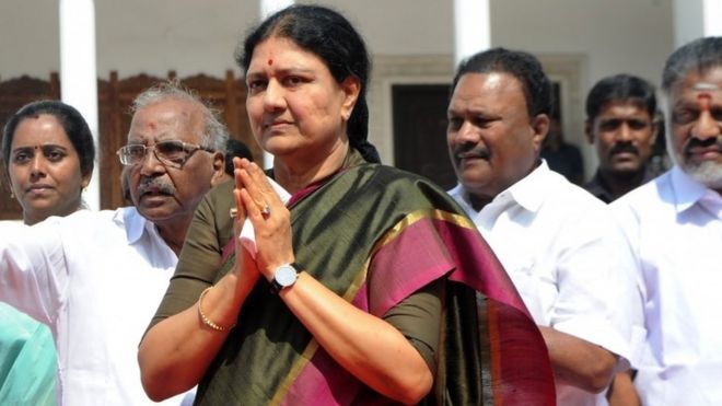 This file photo taken on December 31, 2016 shows VK Sasikala, general secretary of southern Tamil Nadu state's ruling All India Anna Dravida Munnetra Kazhagam (AIADMK), gesturing upon her arrival to take up office at the AIADMK headquarters in Chennai