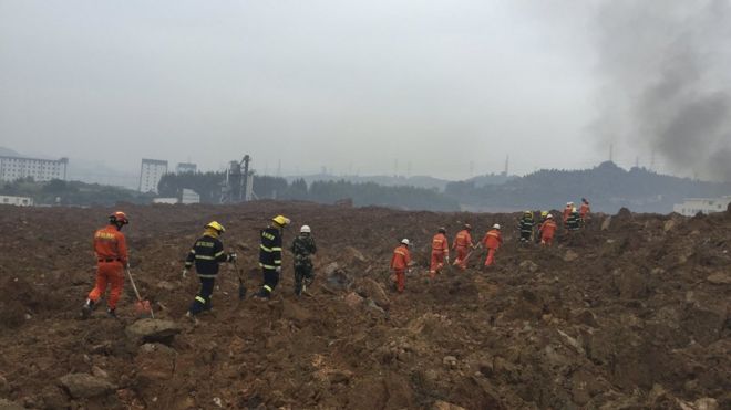 Rescuers search for survivors at the site of a landslide at an industrial park in Shenzhen, Guangdong province, China, December 20, 2015.