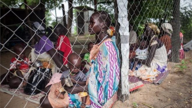 Families with malnourished children wait to receive treatment at the Leer Hospital, South Sudan, on July 7, 2014.